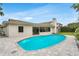 Backyard oasis featuring a sparkling swimming pool and a patio next to the home's exterior at 7032 Pelican Island Dr, Tampa, FL 33634