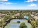 A tennis court and community pool and lounging area at 7103 Bridgeview Dr, Wesley Chapel, FL 33545