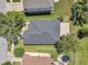 Direct overhead aerial view highlighting roof of home plus fenced yard and trampoline at 7103 Bridgeview Dr, Wesley Chapel, FL 33545