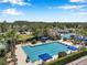 Community tennis courts and swimming pools including many lounge chairs at 7103 Bridgeview Dr, Wesley Chapel, FL 33545