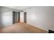 Bright bedroom featuring a closet with custom shelving and neutral walls at 7103 Bridgeview Dr, Wesley Chapel, FL 33545