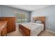 Bedroom with natural light and wooden dresser at 7103 Bridgeview Dr, Wesley Chapel, FL 33545
