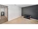 Cozy bedroom with a modern entertainment console and neutral carpet at 7103 Bridgeview Dr, Wesley Chapel, FL 33545