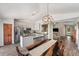 Open concept dining area flows into a modern kitchen and living space, great for entertaining at 7103 Bridgeview Dr, Wesley Chapel, FL 33545