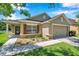 Charming single-story home featuring a well-manicured lawn, neutral paint, and a two-car garage at 7103 Bridgeview Dr, Wesley Chapel, FL 33545