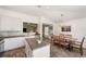 Bright kitchen open to the dining area, complete with island, stainless appliances, and backyard views at 7103 Bridgeview Dr, Wesley Chapel, FL 33545