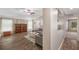 Inviting living room with ample natural light, neutral tones, and open access to other living areas at 7103 Bridgeview Dr, Wesley Chapel, FL 33545
