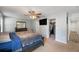 Bright main bedroom with ceiling fan and adjoining bathroom and closet, offering comfort and convenience at 7103 Bridgeview Dr, Wesley Chapel, FL 33545