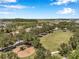 Scenic park with a playground and large grassy field providing ample recreational space at 7103 Bridgeview Dr, Wesley Chapel, FL 33545