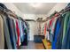 Functional walk-in closet with extensive shelving and hanging space for optimal storage solutions at 7103 Bridgeview Dr, Wesley Chapel, FL 33545