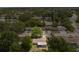 Aerial view of a house showing mature trees on the property and in the surrounding neighborhood at 7215 San Moritz Dr, Port Richey, FL 34668