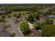 An aerial view showing the property in a neighborhood with a park and lake nearby at 7215 San Moritz Dr, Port Richey, FL 34668