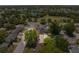 Aerial view of the property in a mature neighborhood with nearby lake and park at 7215 San Moritz Dr, Port Richey, FL 34668
