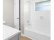 Clean bathroom featuring white hexagonal tile, a tub and a new vanity at 7215 San Moritz Dr, Port Richey, FL 34668