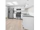 Spacious kitchen featuring stainless steel appliances, ample cabinet space, and modern countertops at 7215 San Moritz Dr, Port Richey, FL 34668