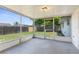 A screened patio looks out over the lawn and is surrounded by a privacy fence at 7215 San Moritz Dr, Port Richey, FL 34668