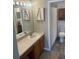 Bathroom featuring a sink, vanity, mirror, and a toilet with shower at 7838 66Th N Way, Pinellas Park, FL 33781