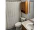 Bathroom with a toilet, vanity and a cabinet mounted above at 7838 66Th N Way, Pinellas Park, FL 33781