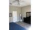 Spacious bedroom with wood floors, white door, a dark dresser and a large mirror at 7838 66Th N Way, Pinellas Park, FL 33781