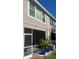 Back exterior of home with screened in patio and landscaping at 7838 66Th N Way, Pinellas Park, FL 33781