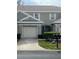 Charming townhome with a one car garage and a well manicured lawn and mature landscaping at 7838 66Th N Way, Pinellas Park, FL 33781