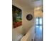 Second floor hallway with wood floors and a large picture of palm trees at 7838 66Th N Way, Pinellas Park, FL 33781