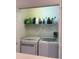 Laundry room with washer, dryer and storage shelves at 7838 66Th N Way, Pinellas Park, FL 33781
