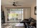 Living room with modern flooring and sliding glass door to backyard patio area at 7838 66Th N Way, Pinellas Park, FL 33781