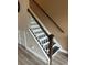 Staircase with dark wood treads and white risers at 7838 66Th N Way, Pinellas Park, FL 33781