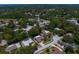 An aerial view showcasing the neighborhood's layout and surrounding greenery at 80 Sycamore Ct, Palm Harbor, FL 34683