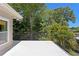 Wide angle shot from a spacious balcony overlooking vibrant green trees at 80 Sycamore Ct, Palm Harbor, FL 34683