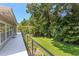 Wide angle shot from a spacious balcony overlooking vibrant green trees at 80 Sycamore Ct, Palm Harbor, FL 34683