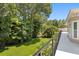 Wide angle shot from a spacious balcony overlooking vibrant green trees at 80 Sycamore Ct, Palm Harbor, FL 34683