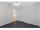 Bright bedroom features light walls, and ceiling fan, plus plenty of closet space at 80 Sycamore Ct, Palm Harbor, FL 34683