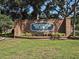Westlake Village brick community sign surrounded by green plants and grass at 80 Sycamore Ct, Palm Harbor, FL 34683