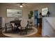 Cozy dining room featuring a hardwood floor, round table with comfortable chairs and soft, neutral decor at 80 Sycamore Ct, Palm Harbor, FL 34683