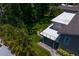Aerial view showcasing the home's deck and surrounding landscaping at 80 Sycamore Ct, Palm Harbor, FL 34683