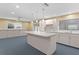 A bright kitchen with lots of cabinet space and an island provides ample room for food preparation and storage at 80 Sycamore Ct, Palm Harbor, FL 34683