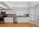 This modern kitchen features stainless steel appliances, stylish countertops and plenty of cabinet space at 80 Sycamore Ct, Palm Harbor, FL 34683