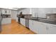 This modern kitchen features stainless steel appliances, stylish countertops and plenty of cabinet space at 80 Sycamore Ct, Palm Harbor, FL 34683