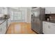 This modern kitchen features stainless steel appliances, granite countertops, and a center island at 80 Sycamore Ct, Palm Harbor, FL 34683