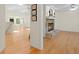 Open-concept room with hardwood floors, skylights, and a beautiful stone fireplace at 80 Sycamore Ct, Palm Harbor, FL 34683