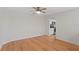 This bright living room has hardwood floors and opens to the kitchen at 80 Sycamore Ct, Palm Harbor, FL 34683