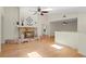 The large living room features hardwood floors and a stone fireplace at 80 Sycamore Ct, Palm Harbor, FL 34683