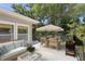 Outdoor patio featuring a dining area and a grill, great for entertaining and relaxing at 80 Sycamore Ct, Palm Harbor, FL 34683