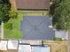 An aerial view shows the house, roof, backyard, and driveway at 807 W Kentucky Ave, Tampa, FL 33603