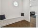 Upstairs hallway with wooden floors, custom seating, and a view into the gym at 807 W Kentucky Ave, Tampa, FL 33603