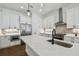 The kitchen features a large center island, stainless steel appliances and white cabinets at 807 W Kentucky Ave, Tampa, FL 33603