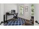 Bright office space with a modern desk setup, comfortable seating, and natural light from the window at 807 W Kentucky Ave, Tampa, FL 33603