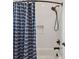 Shower featuring white subway tile surround, black fixtures, and a convenient built-in niche at 807 W Kentucky Ave, Tampa, FL 33603